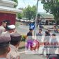 Aksi unjuk rasa Gerakan Revolusi Aktivis Mahasiswa (GERAM) Labuhanbatu Raya di depan gerbang Mapolres Labuhanbatu, Rabu, 28 Mei 2025. (Foto: realitapublik.id)
